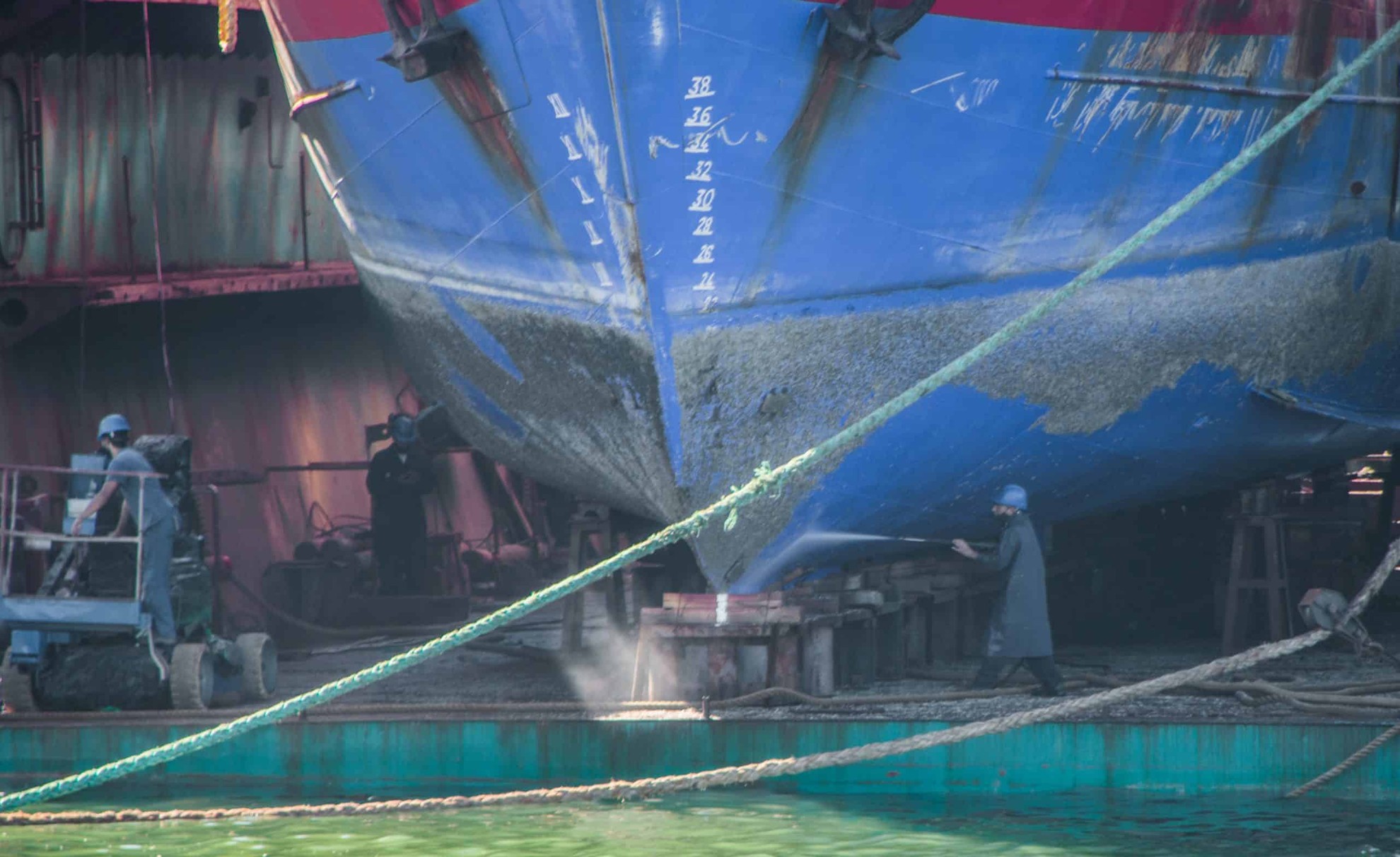 Blue and white ship on water