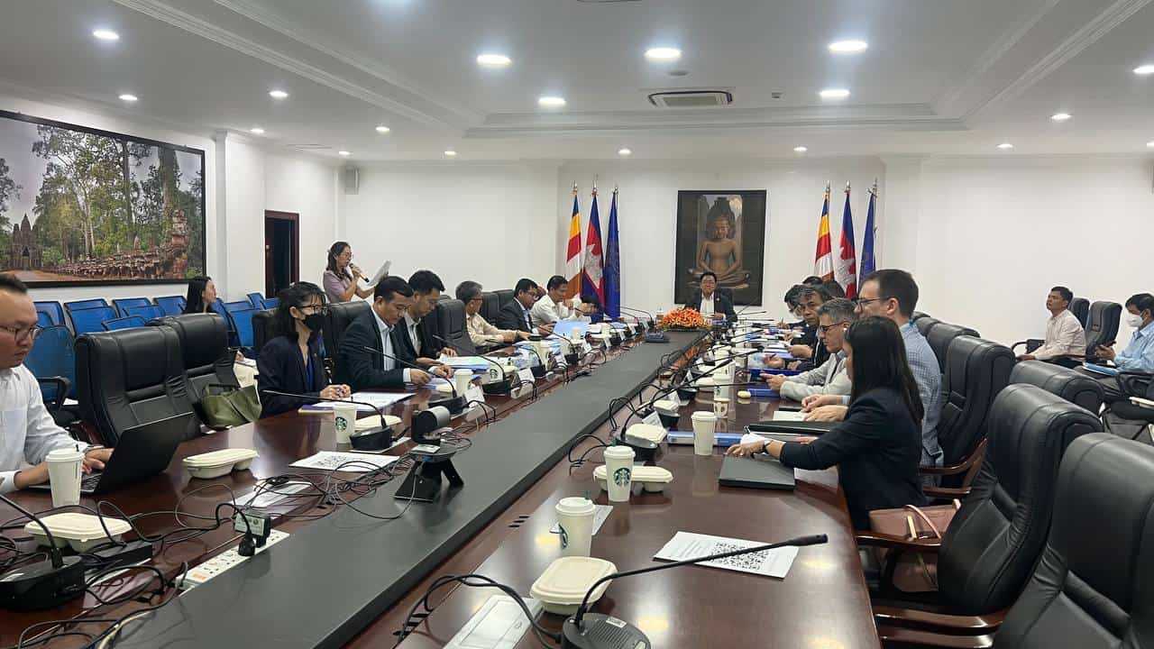 People sitting in a room and taking part in the PAGE Steering Committee 2024