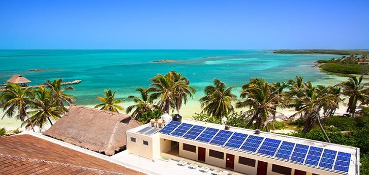 Solar panels on building overlooking sea