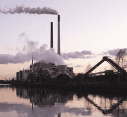 Factory overlooking lake