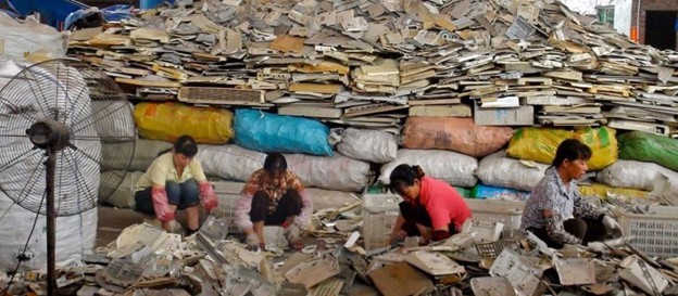 Women sorting through waste