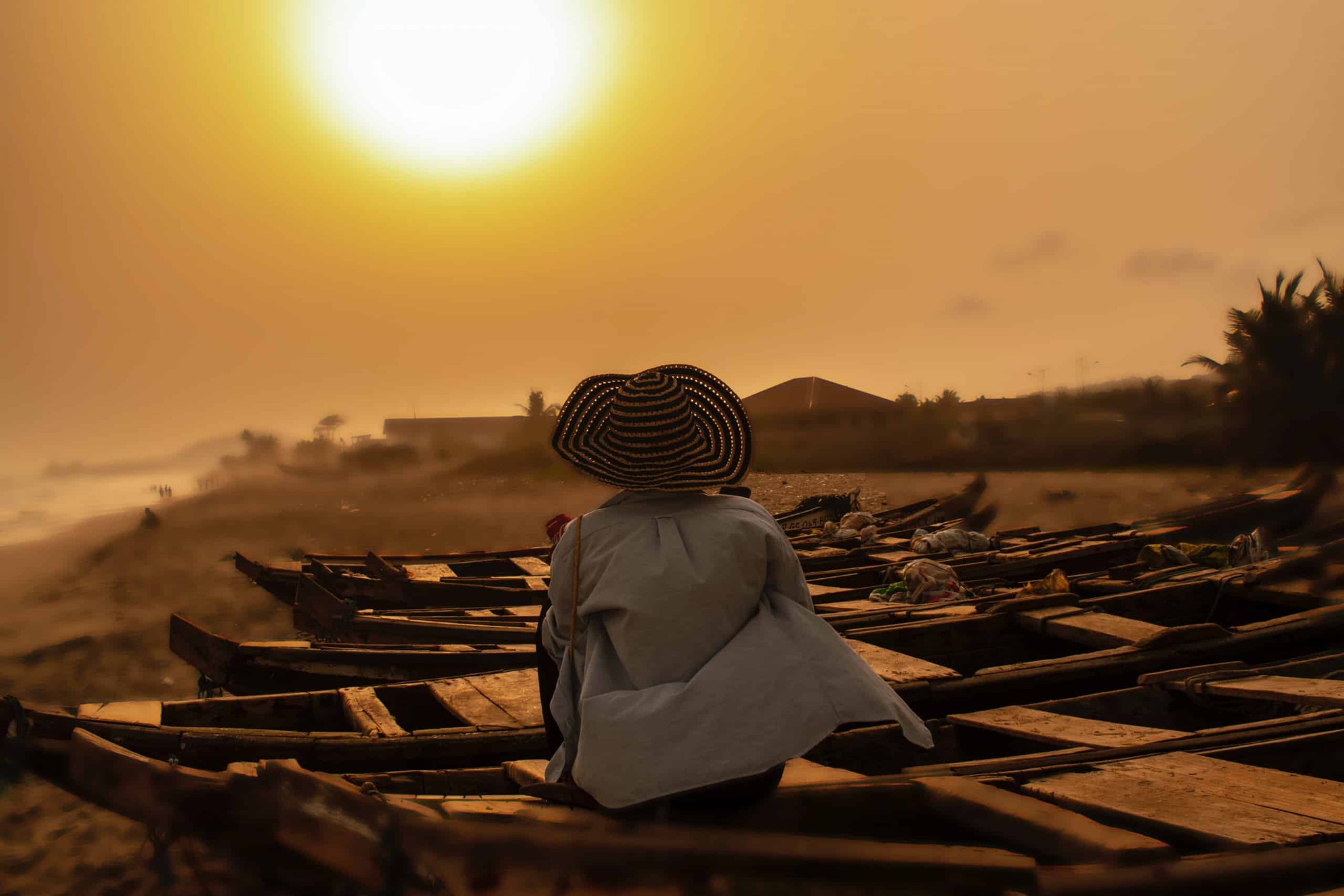 Woman on a boat at sunset