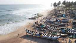 Boats on the beach by the water