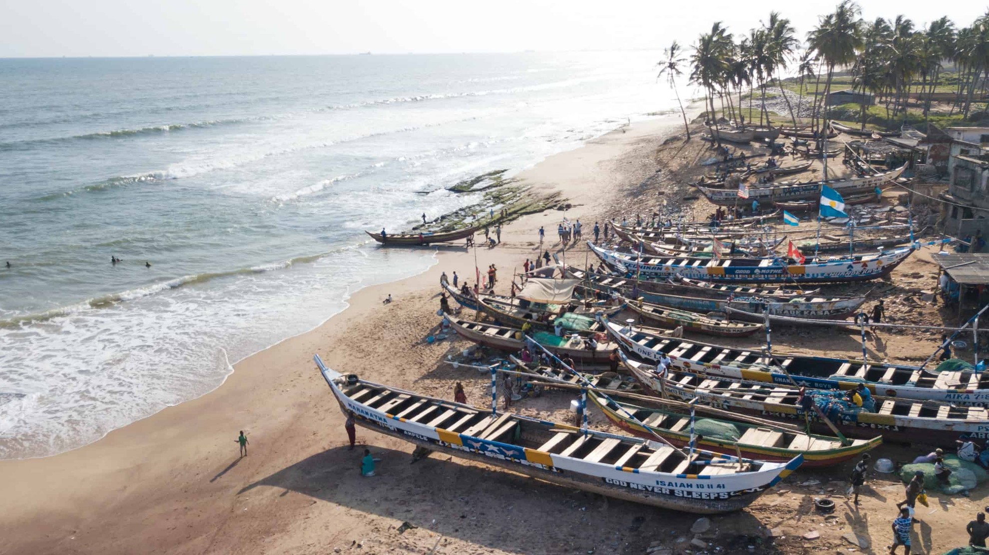 Boats on the beach by the water