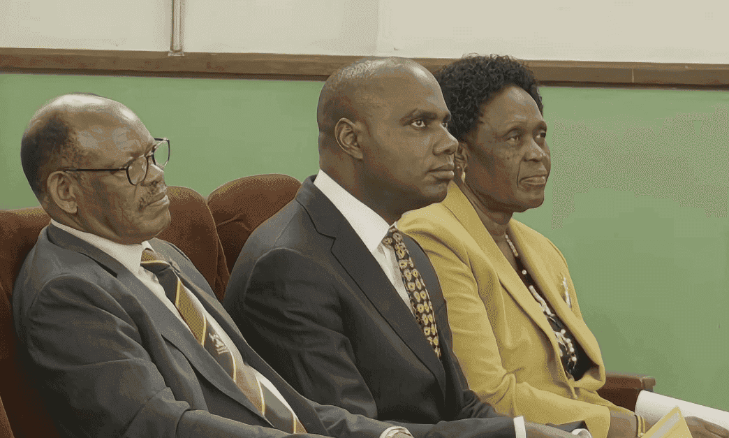 3 ministers sitting in the audience at Makerere University in Uganda.