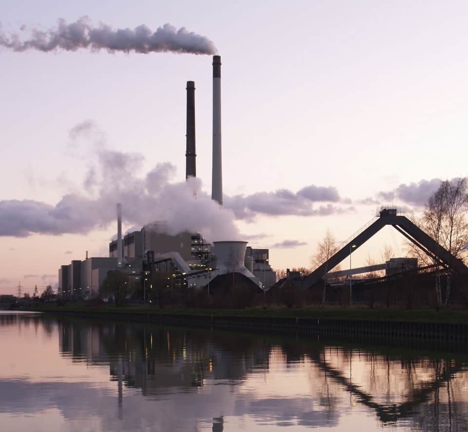 Factory overlooking water