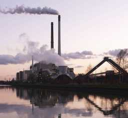 Factory overlooking water