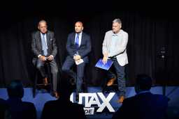 A group of men sitting on stools on stage at the Ruta X Verde sustainability course 2024 launch event