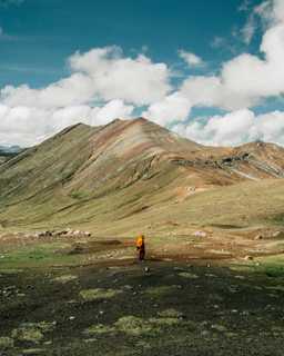 Man stood at foot of mountain